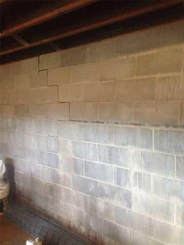 bowing cinder block wall with crack