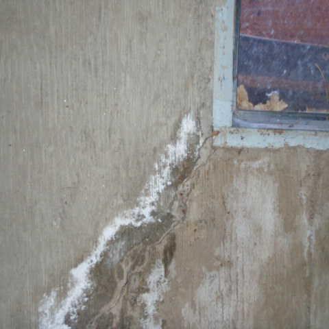 leaky basement window with crack